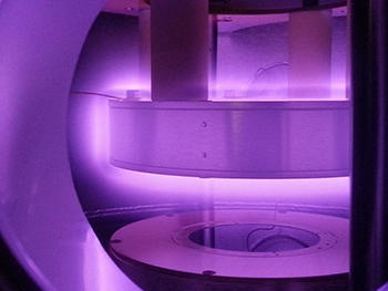 A 3" wafer is seen concentric with the lower plasma electrode.