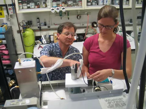 NIST research chemist Tom Bruno and postdoctoral researcher Tara Lovestead assemble an apparatus for detecting and measuring explosives and toxins.