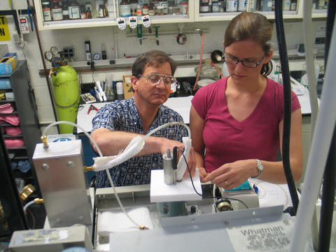 NIST research chemist Tom Bruno and postdoctoral researcher Tara Lovestead assemble an apparatus for detecting and measuring explosives and toxins.