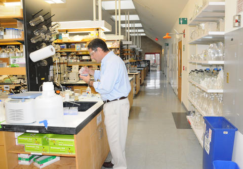 Zvi Kelman, director of NIST's new Biomolecular Labeling Laboratory, works near the lab's five user stations. 