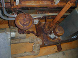 Corroding, leaking, 40-year-old mechanical equipment in a NIST mechanical room support space.