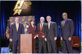 Pictured (Left to right): Commerce Secretary Don Evans; Julie Furst-Bowe, associate vice chancellor, University of Wisconsin-Stout; Charles Sorensen, chancellor, University of Wisconsin-Stout; President Bush; Education Secretary Rod Paige.