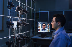NIST computer scientist Ross Micheals demonstrates a NIST-developed system for studying the performance of facial recognition software programs.