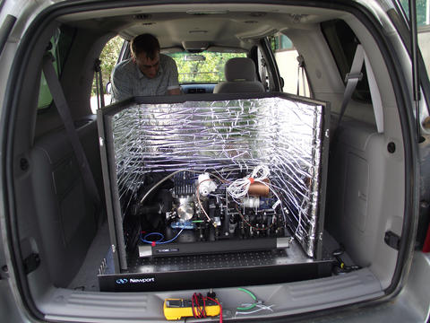 Photo of an advanced laser in the back of a car
