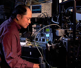 NIST engineer Sae Woo Nam working on a photo detector