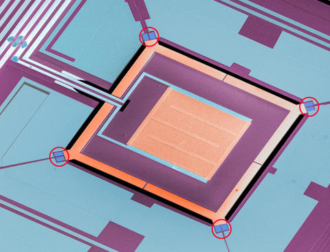 Colorized micrograph of a NIST chip combining four micro-refrigerators with a superconducting sensor