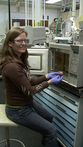 Tara Lovestead prepares a sample of meat for testing