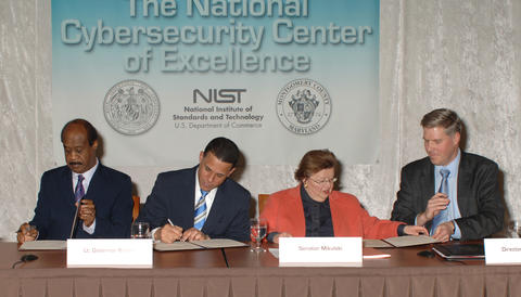Photo of MOU signing for NCCoE