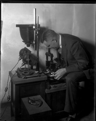 Wilmer Souder using an early comparison microscope