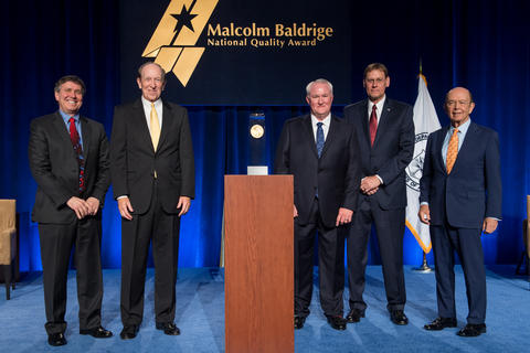 Photo of representatives from Chalmers Ford with representatives from DOC and Baldrige