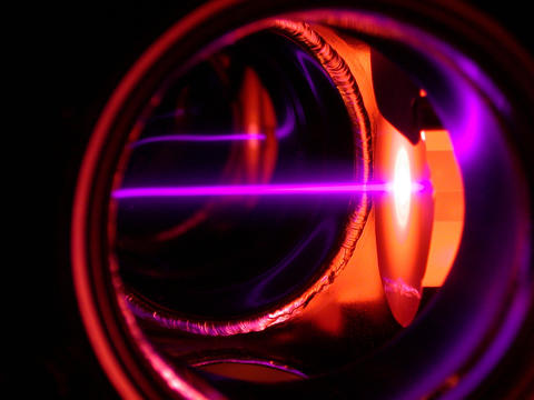 A purple laser beam slows erbium atoms