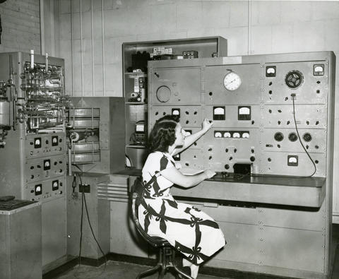 Woman uses gas analysis mass spectrometer at NBS for chemical analysis of gas or vapor mixtures