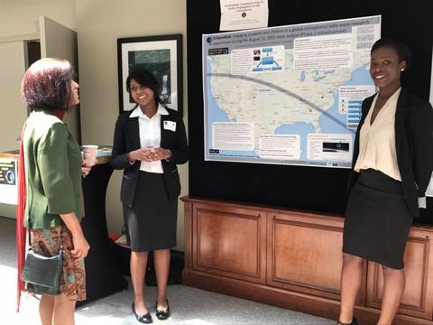 Jennifer Henry and Janet Oputa share the EclipseMob project with attendees at the NCAR/UCAR eclipse media event.