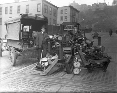 Seattle weights and measures inspectors with condemned scales