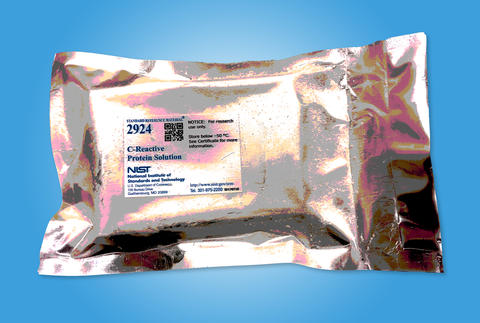 Gold shiny rectangular package with Standard Reference Material 2924 C-Reactive Protein Solution label