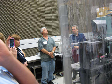 two men looking at a scanning electron microscopy