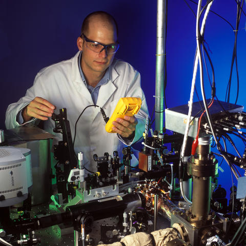 Researcher with the quantum logic clock