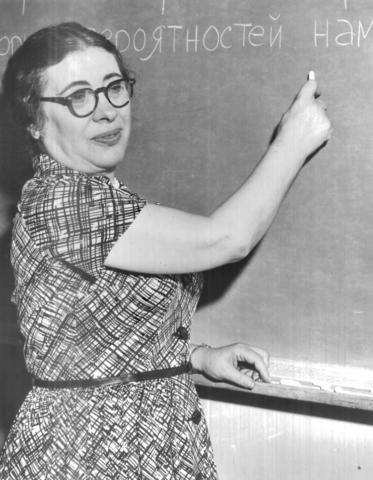 Ida Rhodes standing at a chalkboard