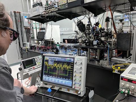 Alan Band working with instrumentation in a CNST lab.