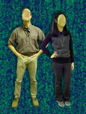 Man and woman with faces scrubbed out against an abstract backdrop.