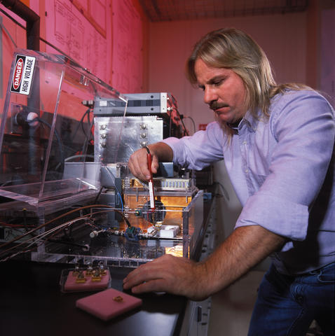 Man standing working on a silicon carbide device