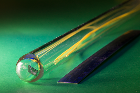 photonic thermometer on a green background