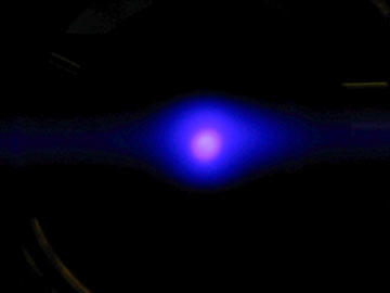 black background with a bluish-purple circle of light in the middle