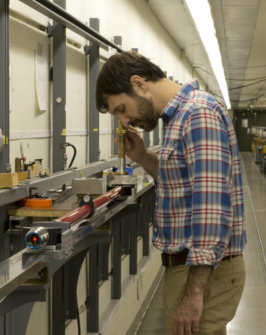 Christopher Blackburn calibrates a length artifact using a new, PML-developed measurement system.