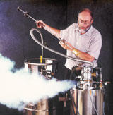 NIST metallurgist Robert Shull loads a sample into an ultracold chamber to measure its promise as a magnetic refrigerant. 