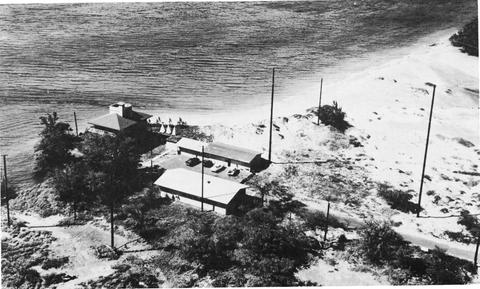 black and white image of the WWVH radio station on the very edge of the Maui shoreline