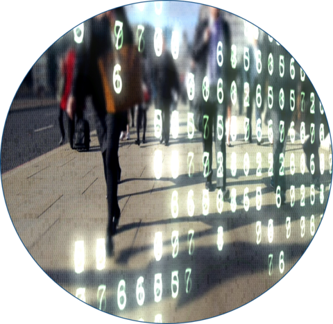 circle with image inside of a crosswalk with people walking around a city and coding in the forefront of the image