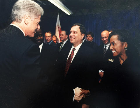 Photo of Jacqueline Calhoun meeting President Clinton at the Baldrige Award Ceremony.