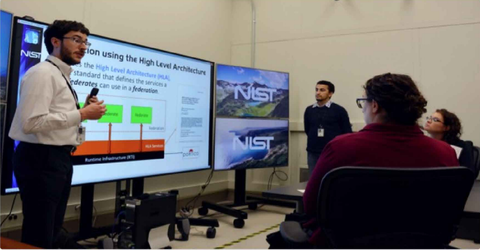 NIST researches explain Testbed operations to visitors