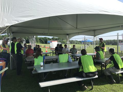 Subject matter expert volunteers brief a competing team at the UAS drone challenge in 2018