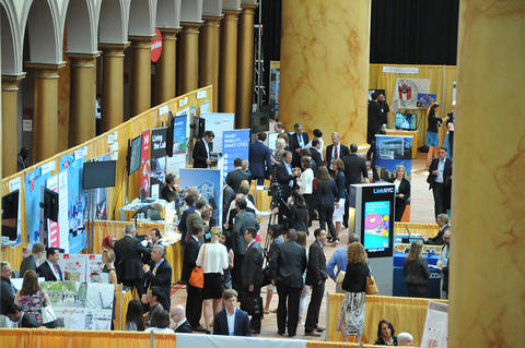 a convention hall bustling with people 