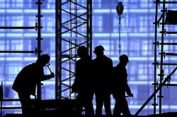 silhouette of men working