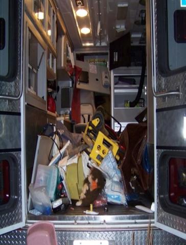 inside of an ambulance with interior a mess after a crash.