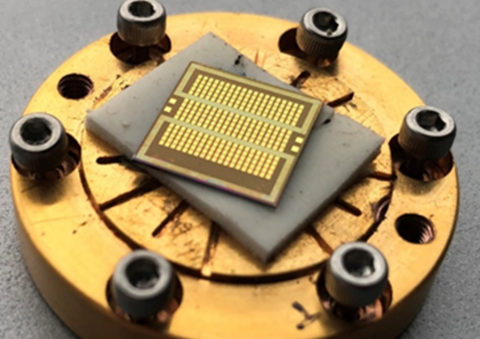 Fig. 1. Colorized scanning electron micrograph of a crossbar array with 30 nm diameter magnetic tunnel junctions, a schematic drawing of the crossbar, and a schematic drawing of a magnetic tunnel junction.