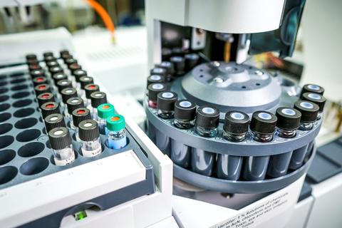 vials of various chemical loaded into a machine for analysis