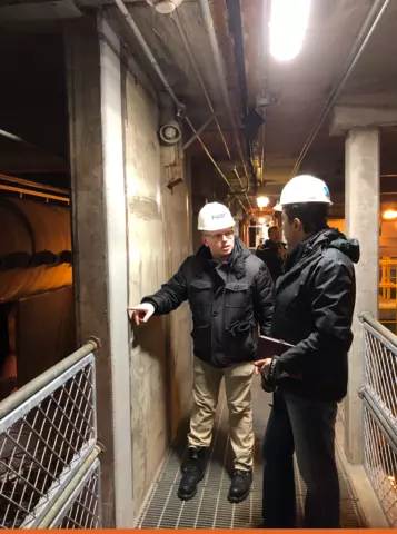David Goodwin (left)&nbsp; and Siamak Sattar from NIST’s Materials and Structural Systems Division examining a wall at the Anchorage Water and Wastewater Treatment Plant after an earthquake in Alaska 2019.