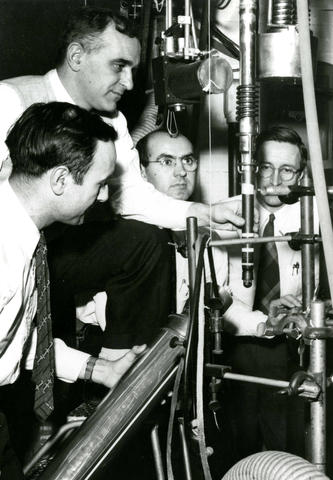 The NIST team with their experimental equipment: from left, Ralph Hudson, Ernest Ambler, Dale Hoppes and Raymond Hayward.