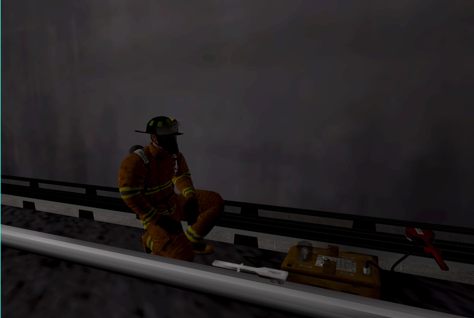 A firefighter on the rails of a subway track