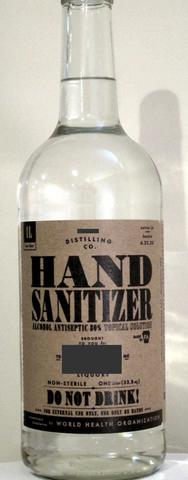 a 1 liter bottle of hand sanitizer that looks a lot like a whiskey bottle