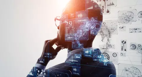 A man looking off into the distance with abstract technology and connections behind him