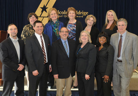 Photo of Barb Fischer and other Baldrige staff at the 2013 Examiner Recognition Event.