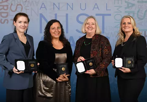 Photo of Barb Fischer and other Baldrige blog staff winning the NIST Bronze Award.