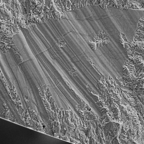 microscopic, cross-section view of a defect within a 3D-printed titanium part