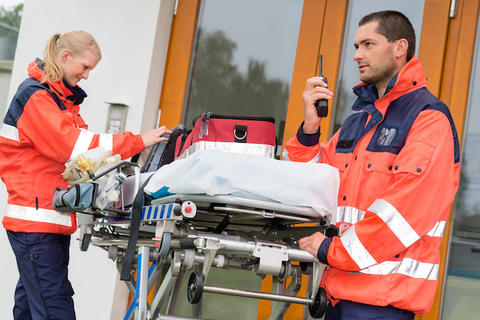 Emergency Medical Technicians talking on radio