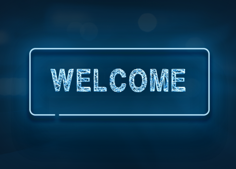 Blue neon sign reads WELCOME