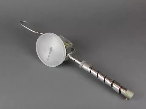 Scientific device has dial and hook on one end, spiral handle on the other.